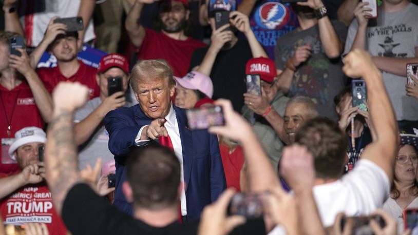 Republican presidential nominee former President Donald Trump points towards the crowd as he arrives for a campaign rally at Ed Fry Arena in Indiana, Pa., Monday, Sept. 23, 2024. (AP Photo/Rebecca Droke)