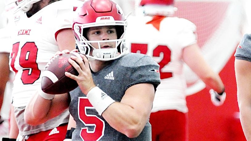 Miami University quarterback Brett Gabbert looks to make a pass during the Spring Showcase at the David and Anita Dauch Indoor Sports Center on Saturday, April 22. DAVID A. MOODIE/CONTRIBUTING PHOTOGRAPHER