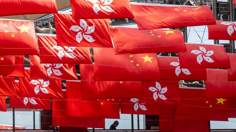 FILE - China and Hong Kong flags are hung as the city marks China's national day in Hong Kong, Sunday, Oct. 1, 2023. (AP Photo/Chan Long Hei, File)