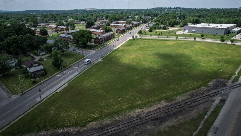 A new food market is coming to West Dayton between McCall and Germantown Streets. The DeSoto Bass housing complex is at the top left of the photo. JIM NOELKER/STAFF