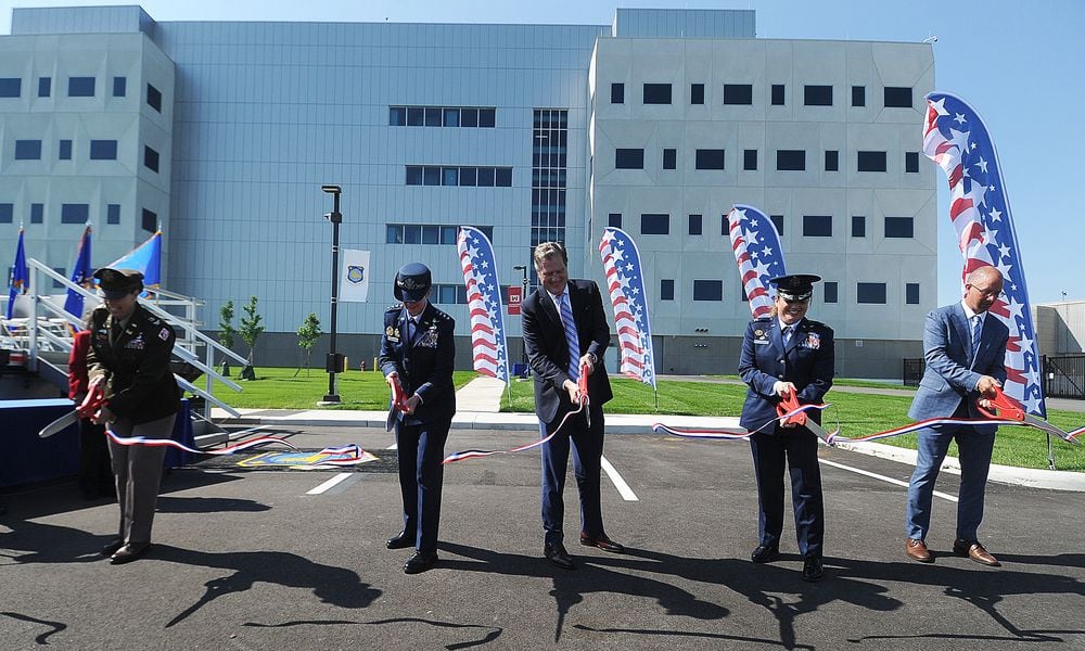 The official ribbon cutting ceremony for the National Air and Space Intelligence Center (NASIC) took place Monday, May 13, 2024. From left, Colonel L. Reyn Mann, Lt. General Leah G. Lauderback, U.S. Congressman Mike Turner, Colonel Ariel G. Batungbacal and Matthew Schnelle, Messer Construction Company. MARSHALL GORBY\STAFF