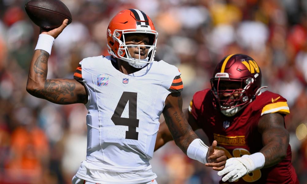 Cleveland Browns quarterback Deshaun Watson (4) looks to pass under pressure from Washington Commanders defensive tackle Phidarian Mathis (98) during the first half of an NFL football game in Landover, Md., Sunday, Oct. 6, 2024. (AP Photo/Nick Wass)