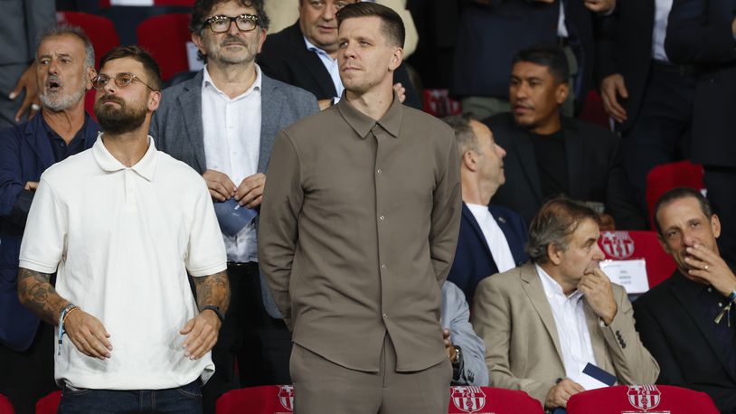 Wojciech Szczesny, centre, a new goalkeeper for Barcelona is on stands during the Champions League soccer match between Barcelona and Young Boys at the Lluis Companys Olympic Stadium in Barcelona, Spain, Tuesday, Oct. 1, 2024. (AP Photo/Joan Monfort)