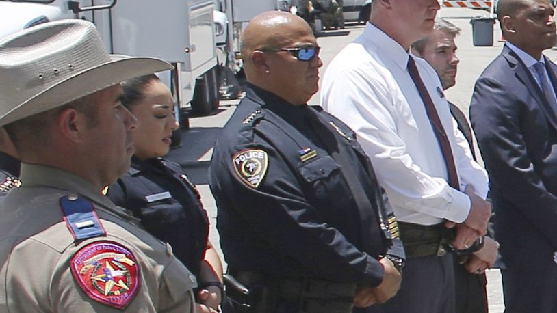 FILE - Uvalde School Police Chief Pete Arredondo, center, stands during a news conference outside of the Robb Elementary school in Uvalde, Texas Thursday, May 26, 2022. (AP Photo/Dario Lopez-Mills, File)