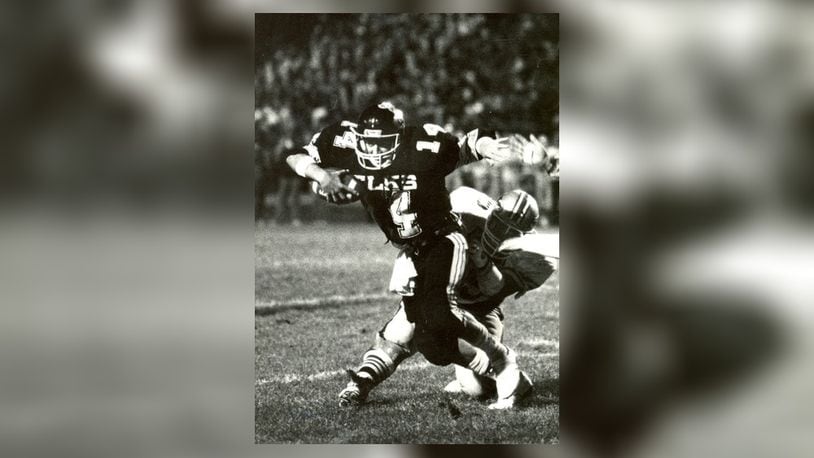 As a junior in 1986 (seen here against Fairmont), Herbstreit set a Centerville record with 317 passing yards in a game. That Elks team went 10-1 with a playoff appearance. DDN FILE