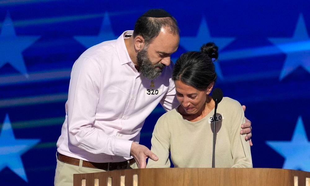 Jon Polin, left, and Rachel Goldberg, parents of Hersh Goldberg-Polin, speak on stage during the Democratic National Convention Wednesday, Aug. 21, 2024, in Chicago. (AP Photo/J. Scott Applewhite)