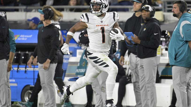 Cincinnati Bengals wide receiver Ja'Marr Chase (1) runs for a touchdown during the second half of an NFL football game against the Jacksonville Jaguars, Monday, Dec. 4, 2023, in Jacksonville, Fla. (AP Photo/Phelan M. Ebenhack)