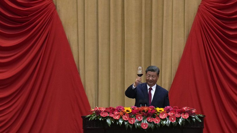 Chinese President Xi Jinping makes a toast on stage after delivering his speech at a dinner marking the 75th anniversary of the founding of the People's Republic of China, at the Great Hall of the People in Beijing, Monday, Sept. 30, 2024. (AP Photo/Andy Wong)