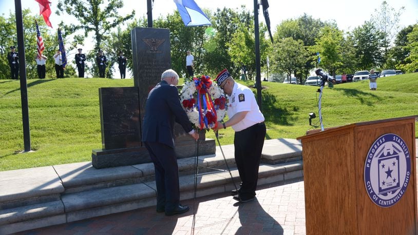 Centerville Mayor Brooks Compton and Fred “Rico” Rojas, post commander of Centerville VFW, place a wreath at Stubbs Park Veterans Memorial Plaza May 29, 2023. Centerville will expand the plaza to include service recognition for the Global War on Terror and add a new monument to recognize the newest military branch, the United States Space Force. CONTRIBUTED