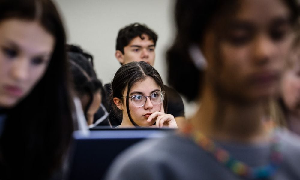 Wright State University freshman Madelyn Schoenberger listens to sociology professor, Chigon Kim, during a class. The U.S. Department of Education announced Tuesday that officials completed reprocessing FAFSA forms impacted by known issues with IRS data, which should enable all universities and colleges to package financial aid offers. JIM NOELKER/STAFF PHOTO