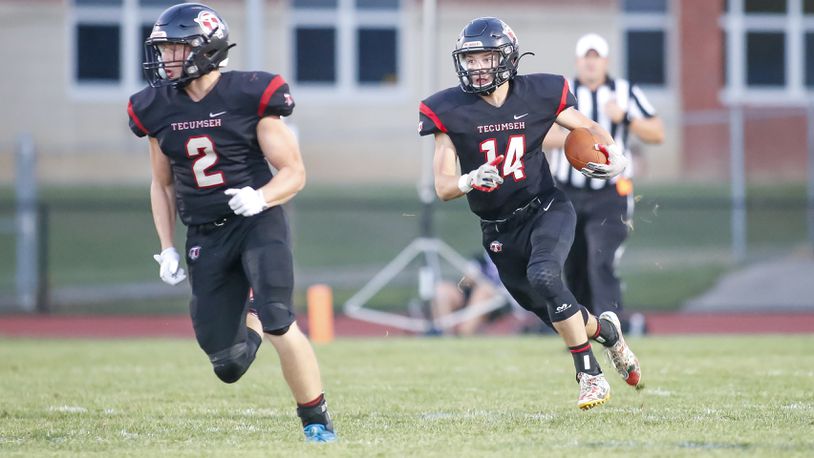 Tecumseh High School junior Tim Moore, Jr. (14) runs the ball during their game against Carroll on Friday, Aug. 26, 2022 at Spitzer Stadium in New Carlisle. The Arrows won 35-3. CONTRIBUTED PHOTO BY MICHAEL COOPER