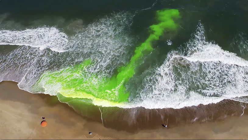 This image provided by NOAA, pictures a harmless green dye used to show a rip current. Rip currents are powerful, narrow channels of fast-moving water that are prevalent along the East, Gulf, and West coasts of the U.S., as well as along the shores of the Great Lakes. About 100 people drown from rip currents along U.S. beaches each year, according to the U.S. Lifesaving Association. (NOAA via AP)