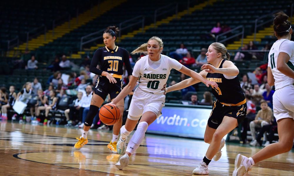 Wright State's Alexis Hutchison looks to drive around a Milwaukee player earlier this season. The Raiders beat the Panthers in the Horizon League quarterfinals on Thursday night. Joe Craven/WSU Athletics