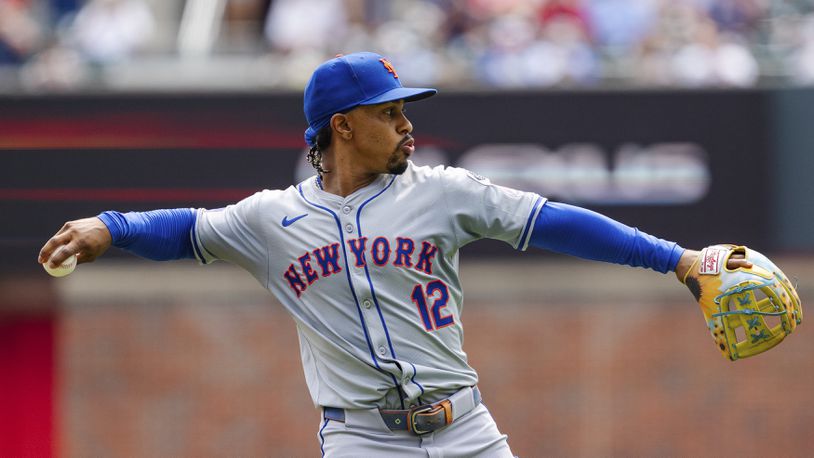 New York Mets shortstop Francisco Lindor throws to first base in the third inning of a baseball game against the New York Mets, Monday, Sept. 30, 2024, in Atlanta. (AP Photo/Jason Allen)