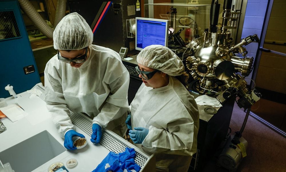 University of Dayton electrical engineering student Malia Hoffmire, left, and UD OASIS program participant Leah Dalton work in the Kettering Lab on the UD campus Monday April 22, 2024. The two women are making semiconductors. JIM NOELKER/STAFF