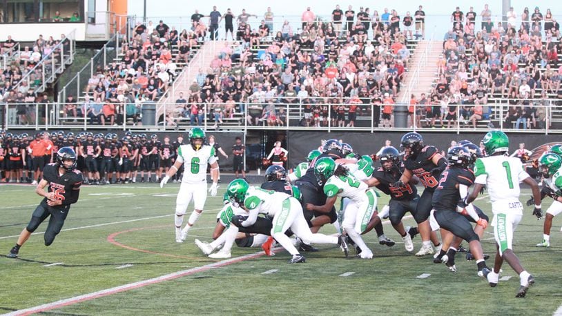 Northmont defense stops Beavercreek's Zane Piatt. Marcus Hartman/STAFF