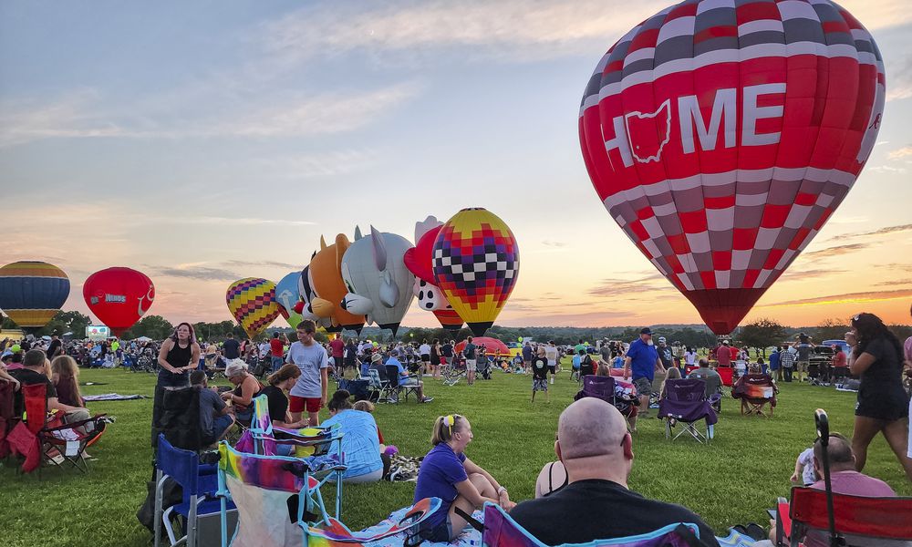 A large crowd gathered for The Ohio Challenge Hot Air Balloon and Skydiving Festival Friday, July 21, 2023 at Smith Park in Middletown. NICK GRAHAM/STAFF