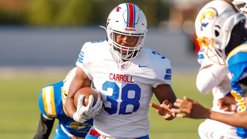 Carroll High School senior Tayshawn Brown runs the ball into the end zone during their game against Ponitz on Thursday, Aug. 22 at Dayton Welcome Stadium. Brown rushed for three TDs as the Patriots won 36-8. Michael Cooper/CONTRIBUTED