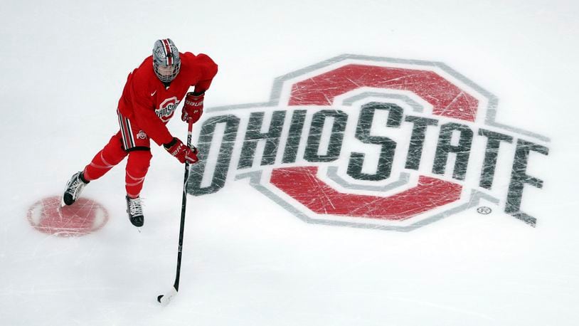 FILE - Ohio State University forward Ronnie Hein guides the puck during NCAA college hockey practice on April 4, 2018, in St. Paul. Minn. Several years into the new age of college sports, where athletes are allowed to profit from their successes through name, image and likeness deals, everyone is still trying to find out what the new normal will be. (Anthony Souffle/Star Tribune via AP, File)