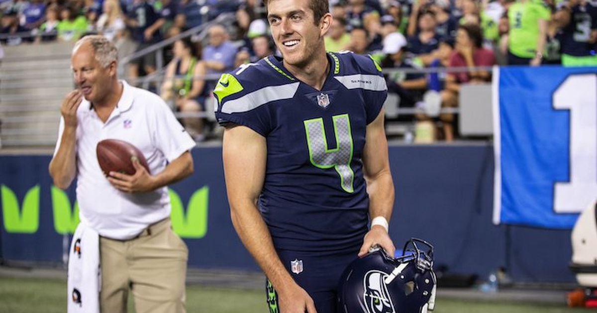 Punter Jon Ryan of the Seattle Seahawks looks on from the sideline