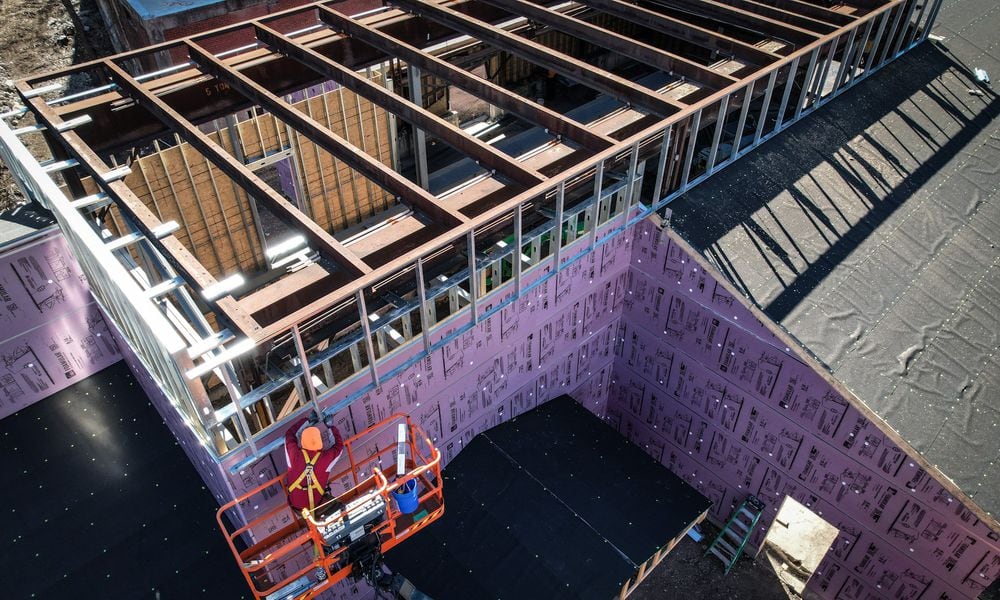 Wes Hartshorn and his two friends/business partners, Shannon Thomas and Scott Johnson, are in the midst of redeveloping 1.5 acres near 2nd Street Market in downtown Dayton into The Silos, a food hall and beer garden with 13,000-square-feet of outdoor space. JIM NOELKER/STAFF