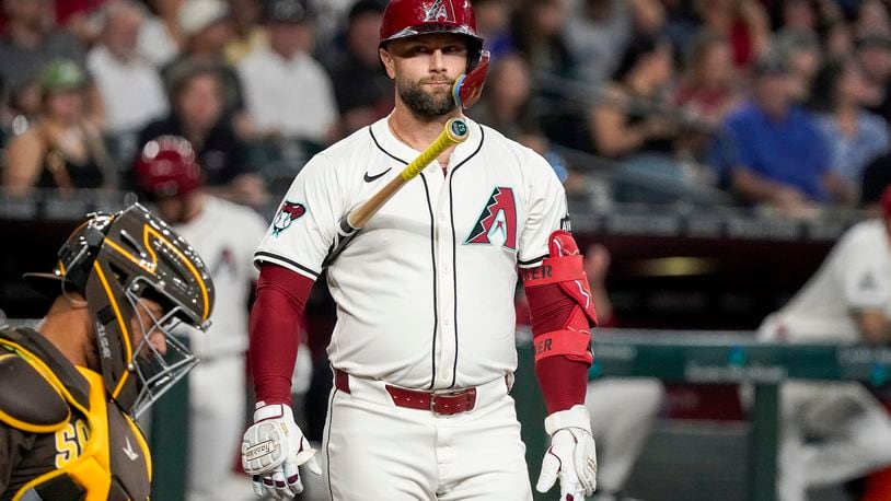 Arizona Diamondbacks' Christian Walker reacts after a pitch call against the San Diego Padres during the first inning of a baseball game, Sunday, Sept. 29, 2024, in Phoenix. (AP Photo/Darryl Webb)