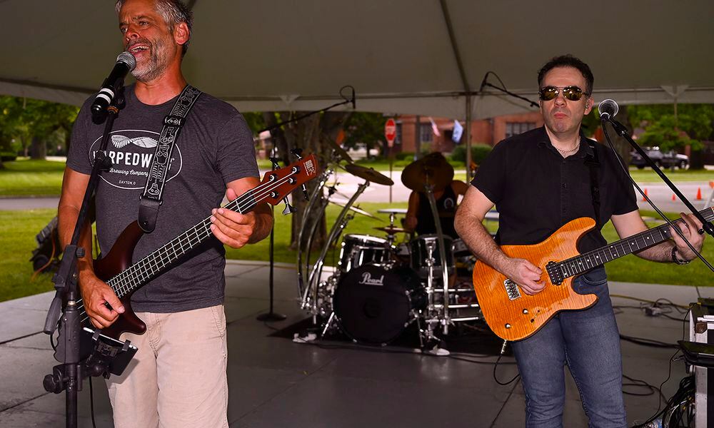 Dave Garwood (left) provides lead vocals and bass while David Hurley plays guitar for Velvet Crush during the first Block Party Concert at Turtle Pond in the Brick Quarters historic district June 24 at Wright-Patterson Air Force Base. Other block parties scheduled by the 88th Force Support Squadron this summer include performances by Stranger, a 1980s cover band, and Parrots of the Caribbean, which is a salute to Jimmy Buffett. U.S. AIR FORCE PHOTO/R.J. ORIEZ