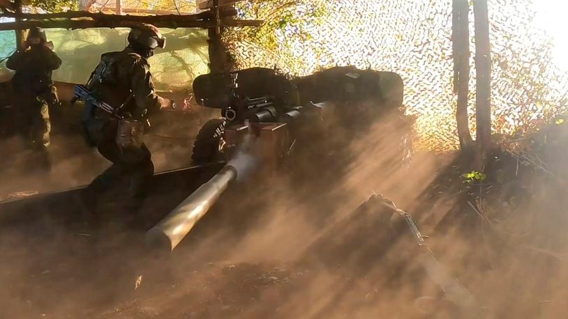 In this photo taken from video released by the Russian Defense Ministry press service on Friday, Aug. 16, 2024, a Russian soldier fires a Rapira anti-tank gun, in the border area of Kursk region, Russia. (Russian Defense Ministry Press Service via AP)