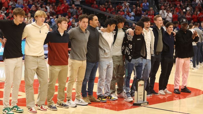 The Dayton men's soccer team is honored during a men's basketball game against George Washington on Tuesday, Jan. 30, 2024, at UD Arena. David Jablonski/Staff