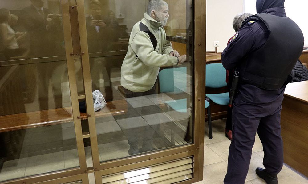 In this photo released by the Moscow City Court Press Service, Stephen Hubbard, a U.S. citizen accused of fighting as a mercenary in Ukraine against Russia stands in a glass cage during a court session in the Moscow City court in Moscow, Russia, Monday, Oct. 7, 2024. (Moscow City Court Press Service via AP)