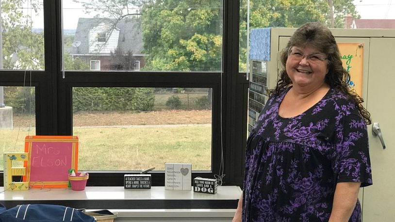 From the windows in her fifth grade classroom at Mound Elementary School, Gina Kinderdine Elson can see the house (with the white dormer) where her great grandfather, Hobby Kinderdine, a standout two-way player and kicker for the Dayton Triangles used to live. He is credited with kicking the first PAT in NFL history when he played in the league’s first ever game at Triangle Park on October 3, 1920. Tom Archdeacon/CONTRIBUTED