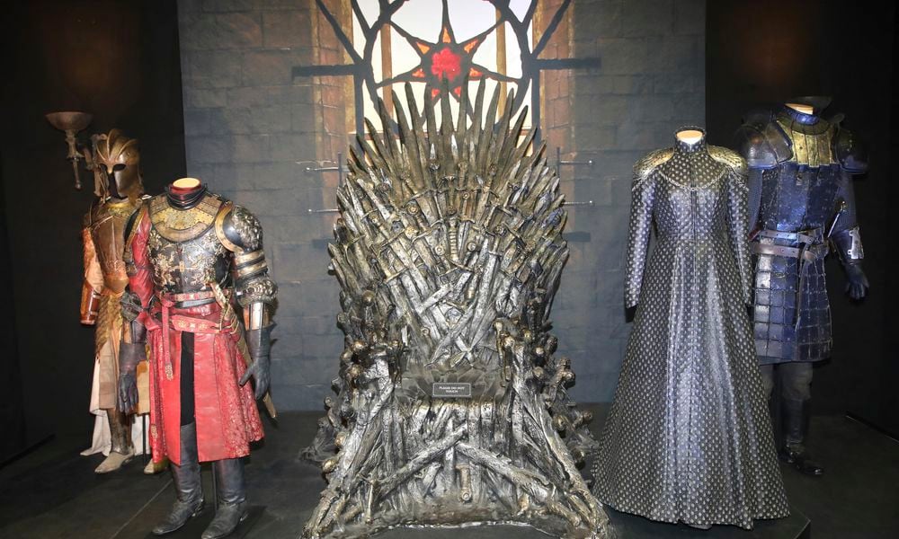 FILE - The Iron Throne and costumes on display during the launch of The Game of Thrones Touring Exhibition at the Titanic Exhibition centre in Belfast, Northern Ireland, Wednesday, April 10, 2019. (AP Photo, File)