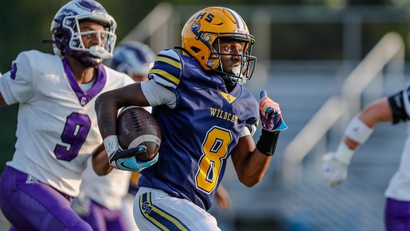 Springfield High School junior Sherrod Lay, Jr. runs the ball during their game against Gonzaga College High School on Friday night at Springfield High School. The Wildcats fell 14-6. Michael Cooper/CONTRIBUTED