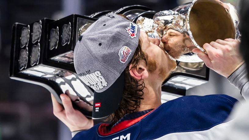 FILE - Saginaw Spirit's Hunter Haight kisses the Memorial Cup after defeating London Knights in the Memorial Cup championship hockey game, June 2, 2024, in Saginaw, Mich. (Kaytie Boomer/Saginaw News via AP, File)