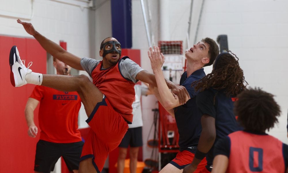 Dayton's Zed Key, left, and Amal L'Etang battle for a rebound during a preseason practice on Wednesday, Oct. 2, 2024, at the Cronin Center. David Jablonski/Staff