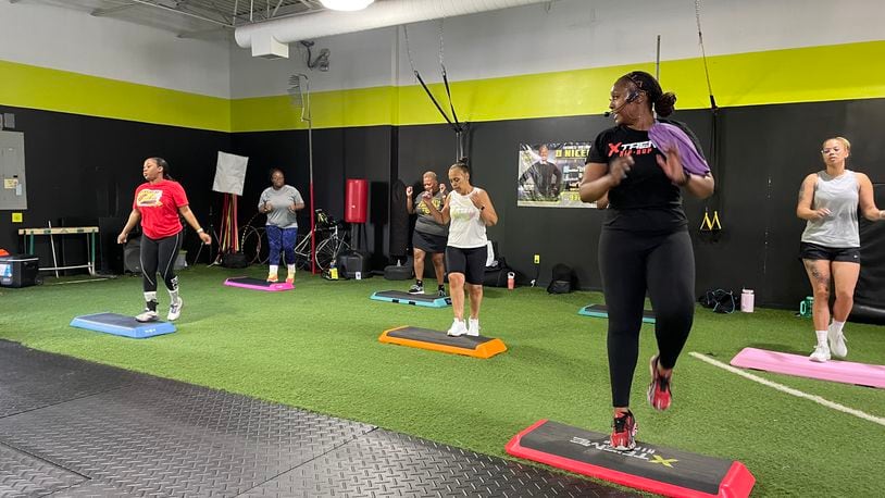 Courtney Ely, who owns CME Sweat Fitness, teaches Xtreme Hip-Hop step classes at DNSFit Studio, 4616 Salem Ave. in Trotwood. NATALIE JONES/STAFF