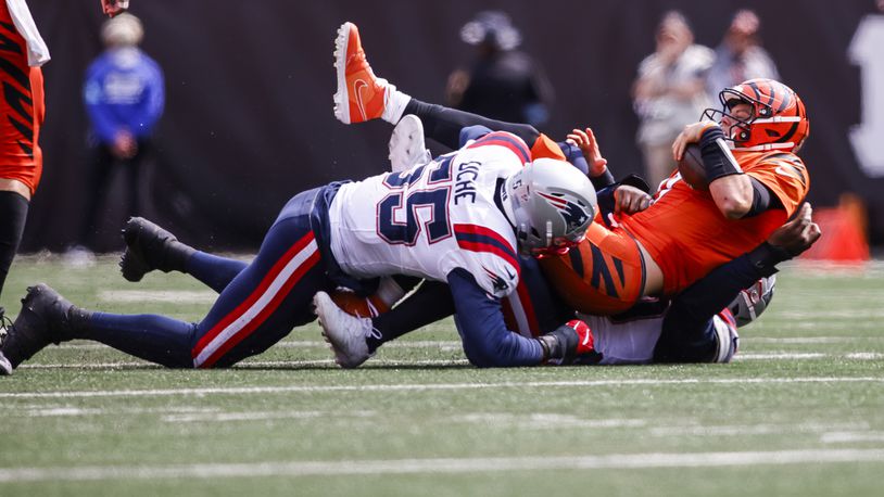 Bengals quarterback Joe Burrow runs the ball during their 16-10 loss to New England Patriots Sunday, Sept. 8, 2024 at Paycor Stadium in Cincinnati. NICK GRAHAM/STAFF