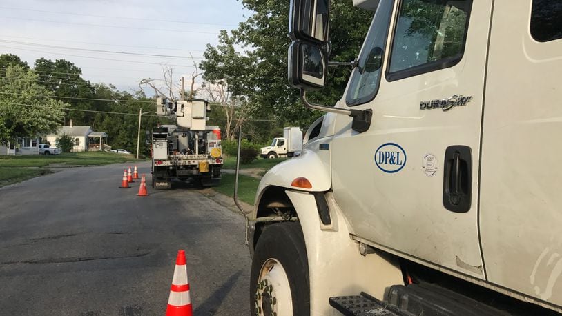 Dayton Power & Light trucks were parked on Fruedenberger Ave. on the west side of Dayton as crews worked to restore power in this file photo.