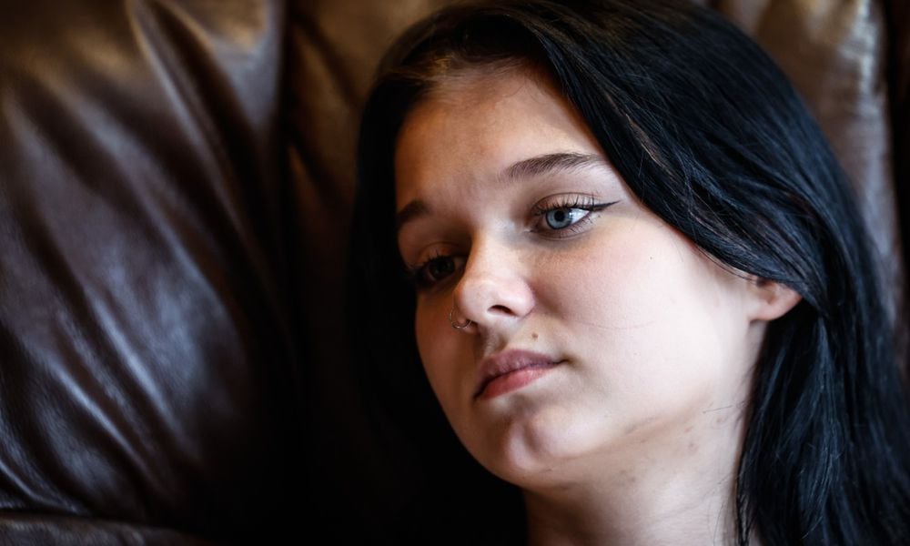 Springboro High School student Rhiannon Price struggled with her metal health. Price is now feeling better and hoping her story will help other teenagers who are struggling. JIM NOELKER/STAFF