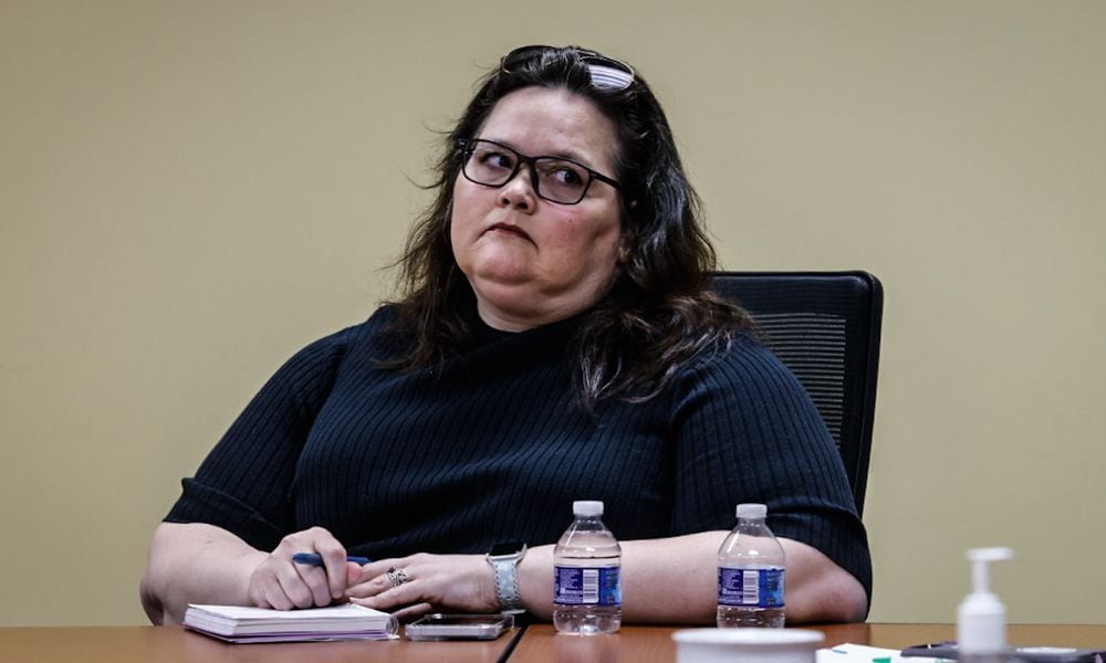 Sarah Brown, team lead at the former Crisis Now hotline's call center that was previously run by RI International, listens in during a meeting between Montgomery County ADAMHS and community stakeholders on Wednesday morning, May 22. JIM NOELKER/STAFF