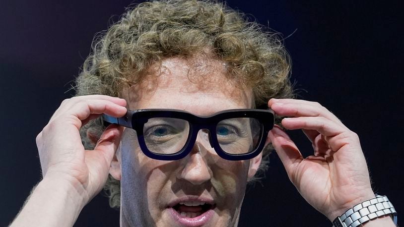 Mark Zuckerberg wears a pair of Orion AR glasses during the Meta Connect conference Wednesday, Sept. 25, 2024, in Menlo Park, Calif. (AP Photo/Godofredo A. Vásquez)