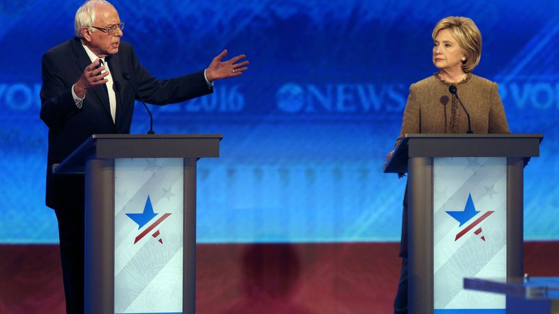 Bernie Sanders, left, offers an apology to Hillary Clinton during a Democratic presidential primary debate Saturday, Dec. 19, 2015, at Saint Anselm College in Manchester, N.H. (AP Photo/Jim Cole)