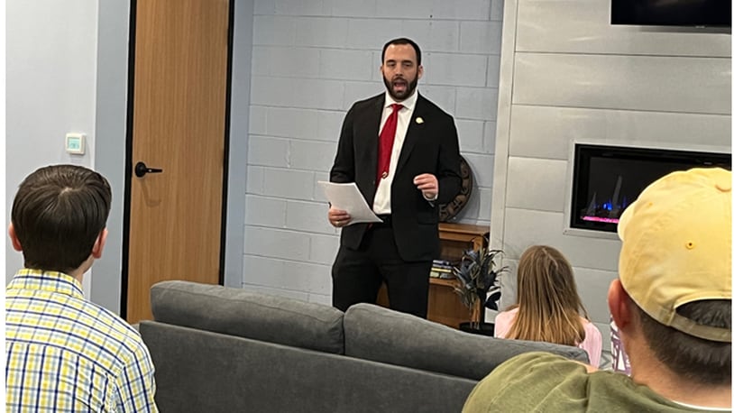 State Rep. Adam Mathews, R-Lebanon, explains his proposed bill to eliminate Ohio's state individual income tax over the next six years during a town hall in Mason on Tuesday, Jan. 23, 2024. The audience of about a dozen people were receptive to the idea but expressed some skepticism on the lack of concrete details. ED RICHTER/STAFF