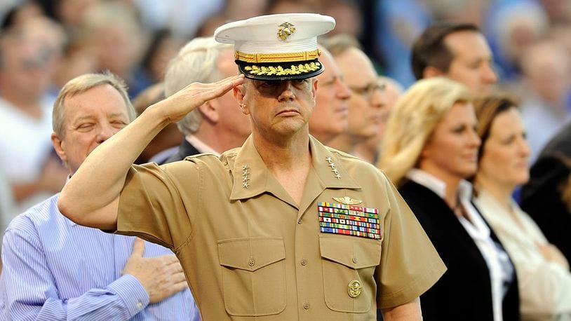CHICAGO, IL - MAY 19: General John R. Allen, USMC-Commander, International Security Assistance Force salutes during the national anthem before the game between the Chicago Cubs and the Chicago White Sox on May 19 2012 at Wrigley Field in Chicago, Illinois. (Photo by David Banks/Getty Images)