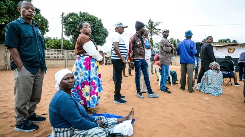 People queue to cast their votes during general elections in Maputo, Mozambique, Wednesday, Oct. 9, 2024. (AP Photo/Carlos Equeio)