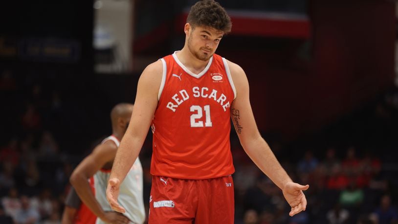 The Red Scare's Grant Basile prepares to shoot a free throw against Carmen's Crew in the second round of The Basketball Tournament on Monday, July 22, 2024, at UD Arena. David Jablonski/Staff