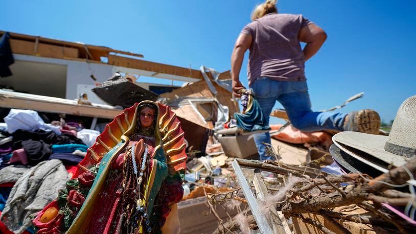 A Guadalupe Virgin statue is seen in the destroyed home of Juana Landeros, who rode out deadly tornado with her husband and her 9-year-old son when it rolled through the previous night, Sunday, May 26, 2024, in Valley View, Texas. Powerful storms left a wide trail of destruction Sunday across Texas, Oklahoma and Arkansas after obliterating homes and destroying a truck stop where drivers took shelter during the latest deadly weather to strike the central U.S. (AP Photo/Julio Cortez)
