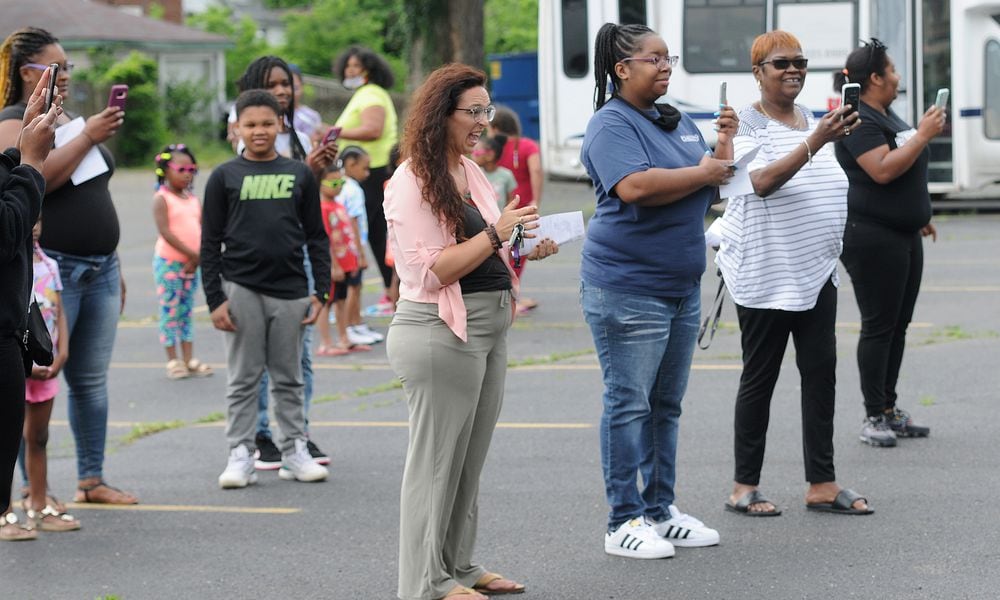 Parents and family members take photos Friday of the class of 2020 graduaton ceremony at the On Purpose Academy and Mentoring Center. MARSHALL GORBY\STAFF