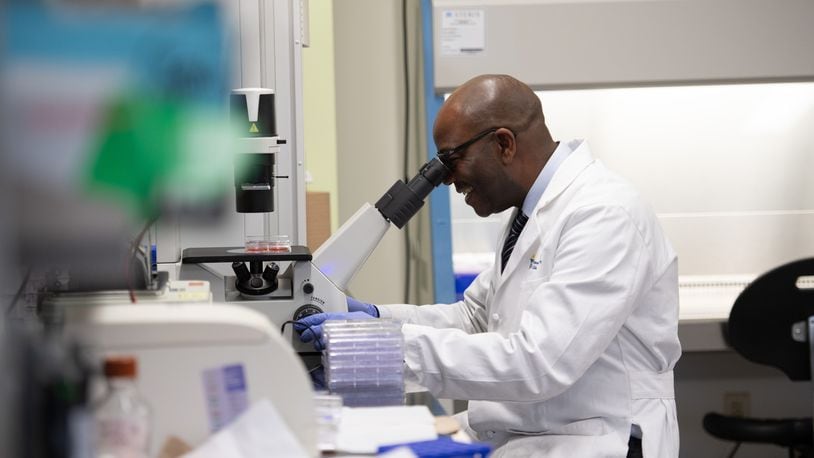 Dr. Samson Amos studies human cells in his laboratory at Cedarville University. SCOTT HUCK/CEDARVILLE UNIVERSITY