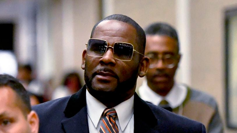 FILE - R. Kelly leaves the Daley Center after a hearing in his child support case, May 8, 2019, in Chicago. (AP Photo/Matt Marton, File)